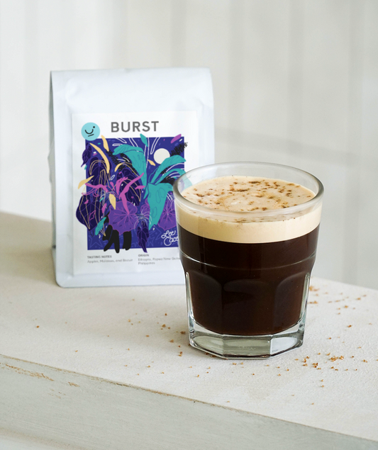 A cup of Plain Sight's Apple Burst Aerocano coffee drink