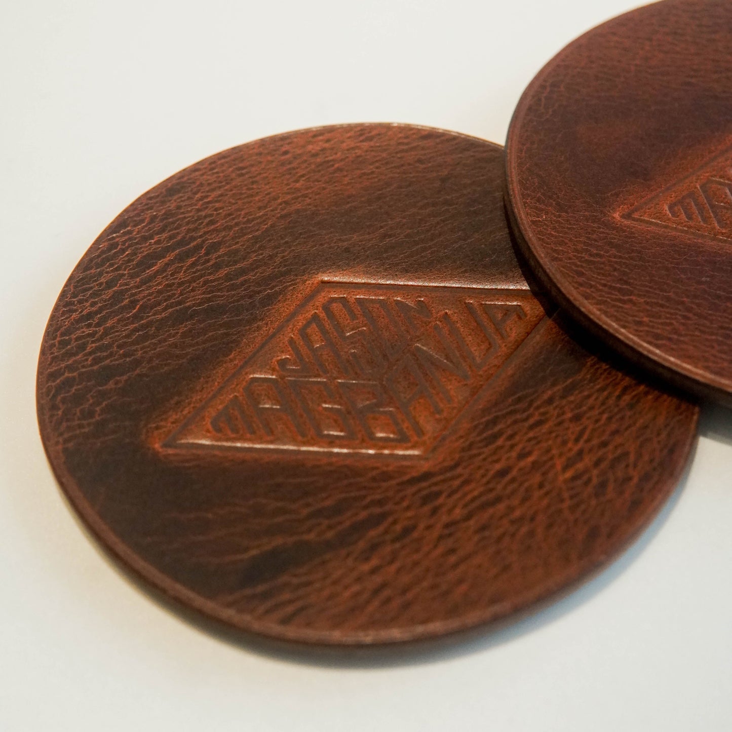 SDE Leather Coaster by Jason Magbanua