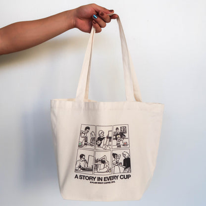 The Plain Sight Story Tote from the front, featuring the Story illustration